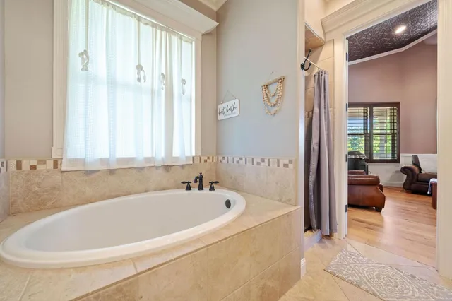 a front view of house with yard and trees