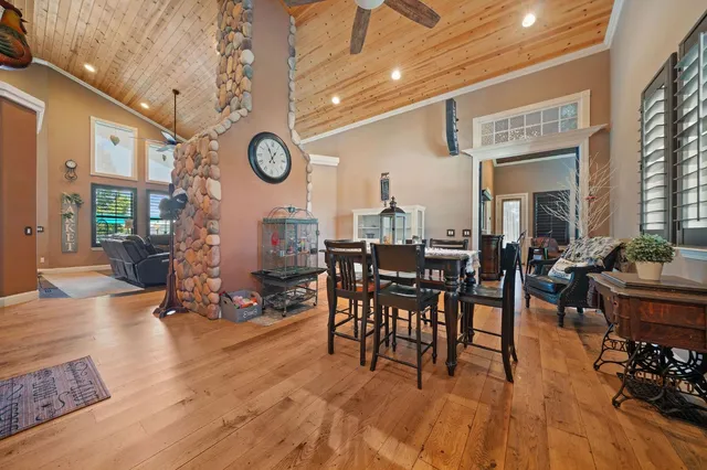 a view of a dining room with furniture and window