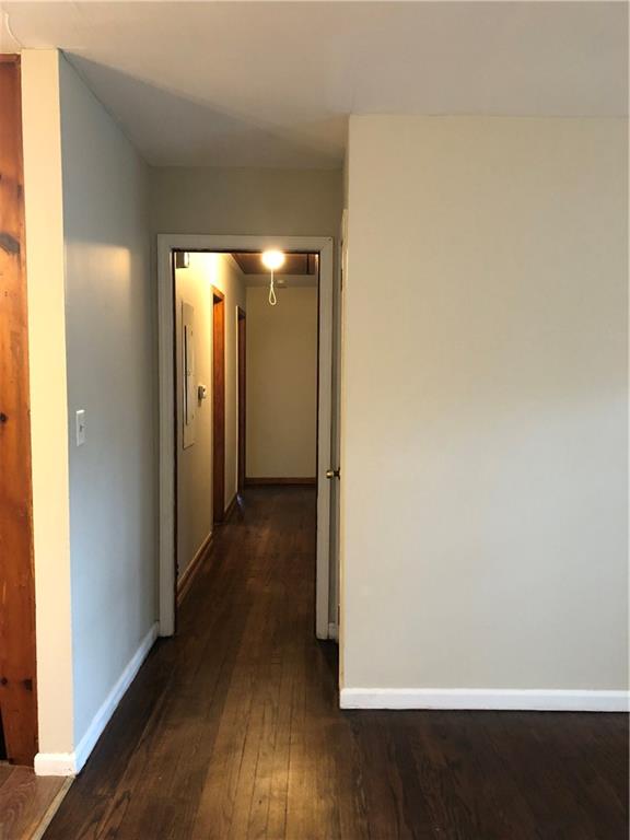 1048 Mantissa Street Northwest Atlanta, GA 30318 - Photo 5 of 12 a view of a hallway with wooden floor