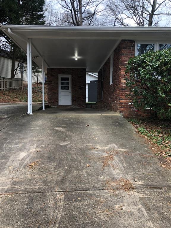 1048 Mantissa Street Northwest Atlanta, GA 30318 - Photo 9 of 12 a view of a house with a garage