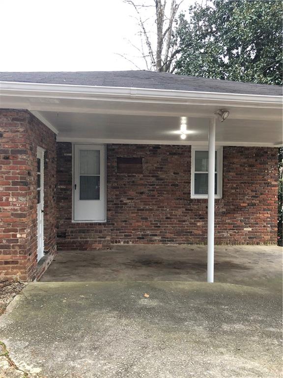 1048 Mantissa Street Northwest Atlanta, GA 30318 - Photo 10 of 12 a view of house with door