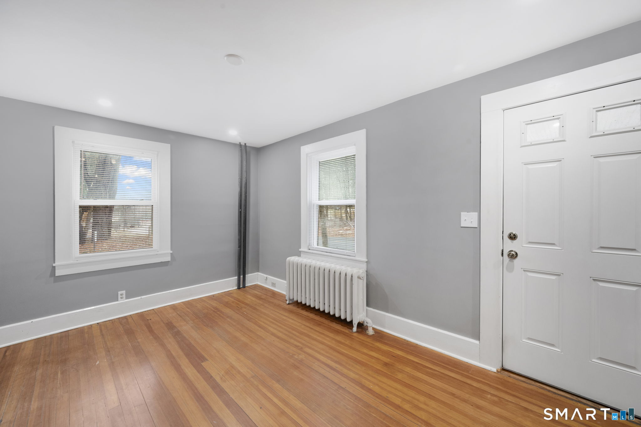 37 Bushy Hill Road Simsbury, CT 06070 - Photo 13 of 23 an empty room with wooden floor and windows