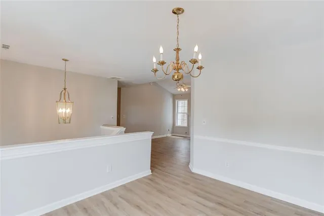 an empty room with fan and a ceiling fan