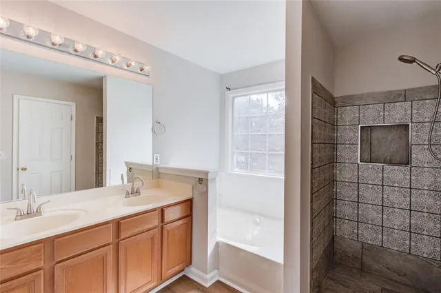 a view of an empty room and wooden floor