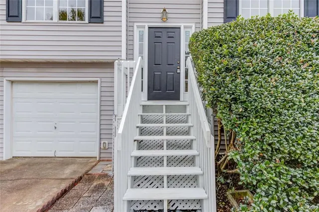 a view of staircase with white walls and windows
