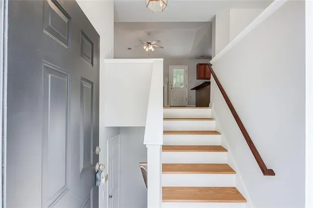 a view of an entryway with wooden floor