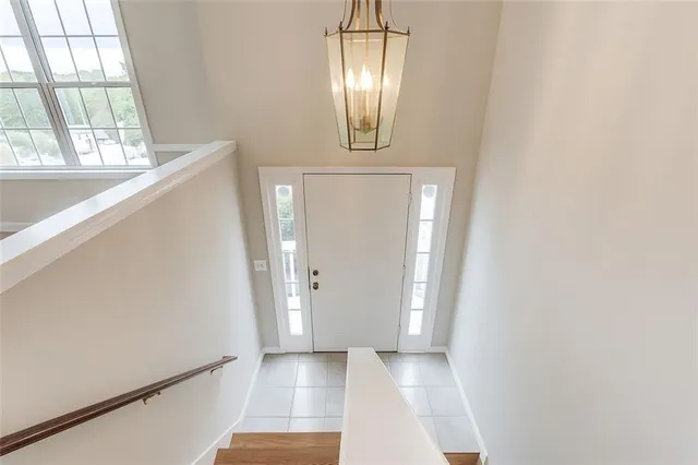 a view of a kitchen with a sink a fireplace and a window