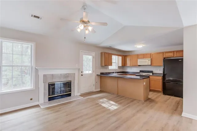 a view of kitchen with sink and wooden floor