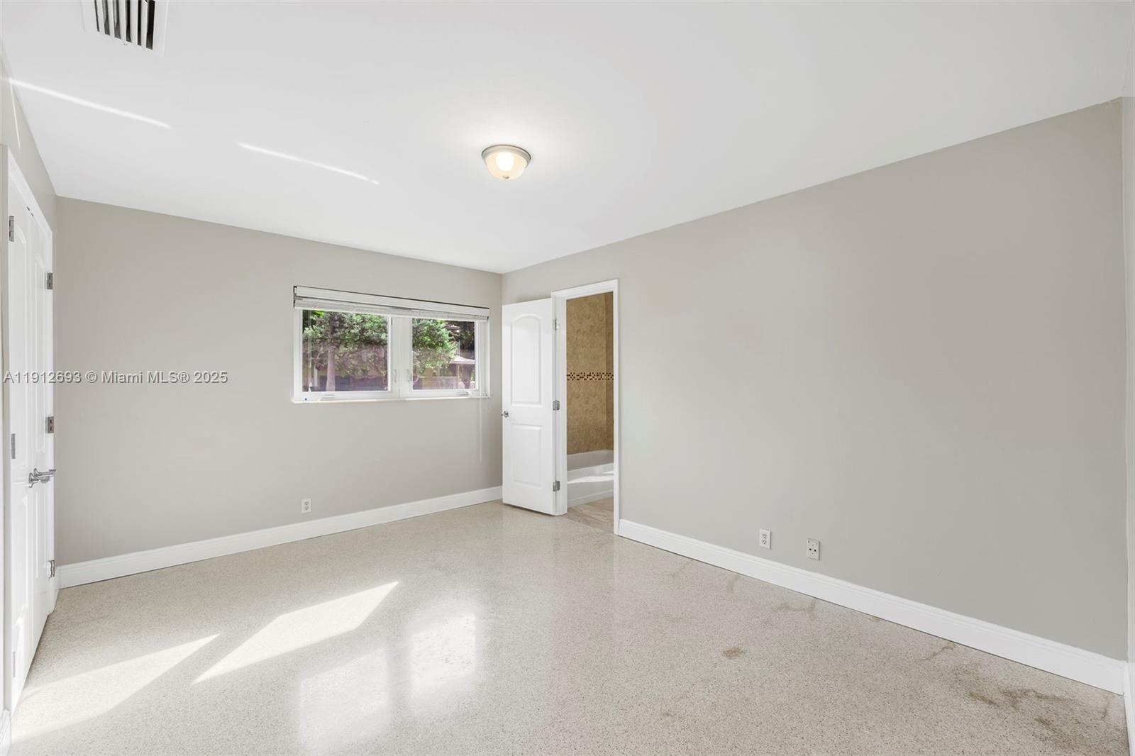 633 Solar Isle Drive Fort Lauderdale, FL 33301 - Photo 21 of 57 a view of an empty room with a window