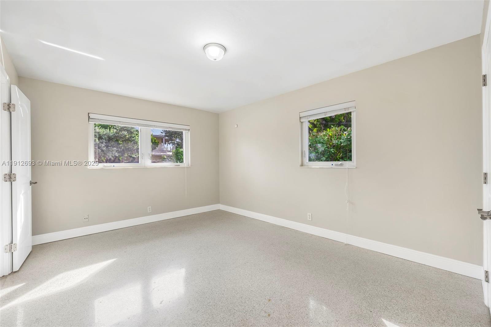 633 Solar Isle Drive Fort Lauderdale, FL 33301 - Photo 23 of 57 an empty room with windows