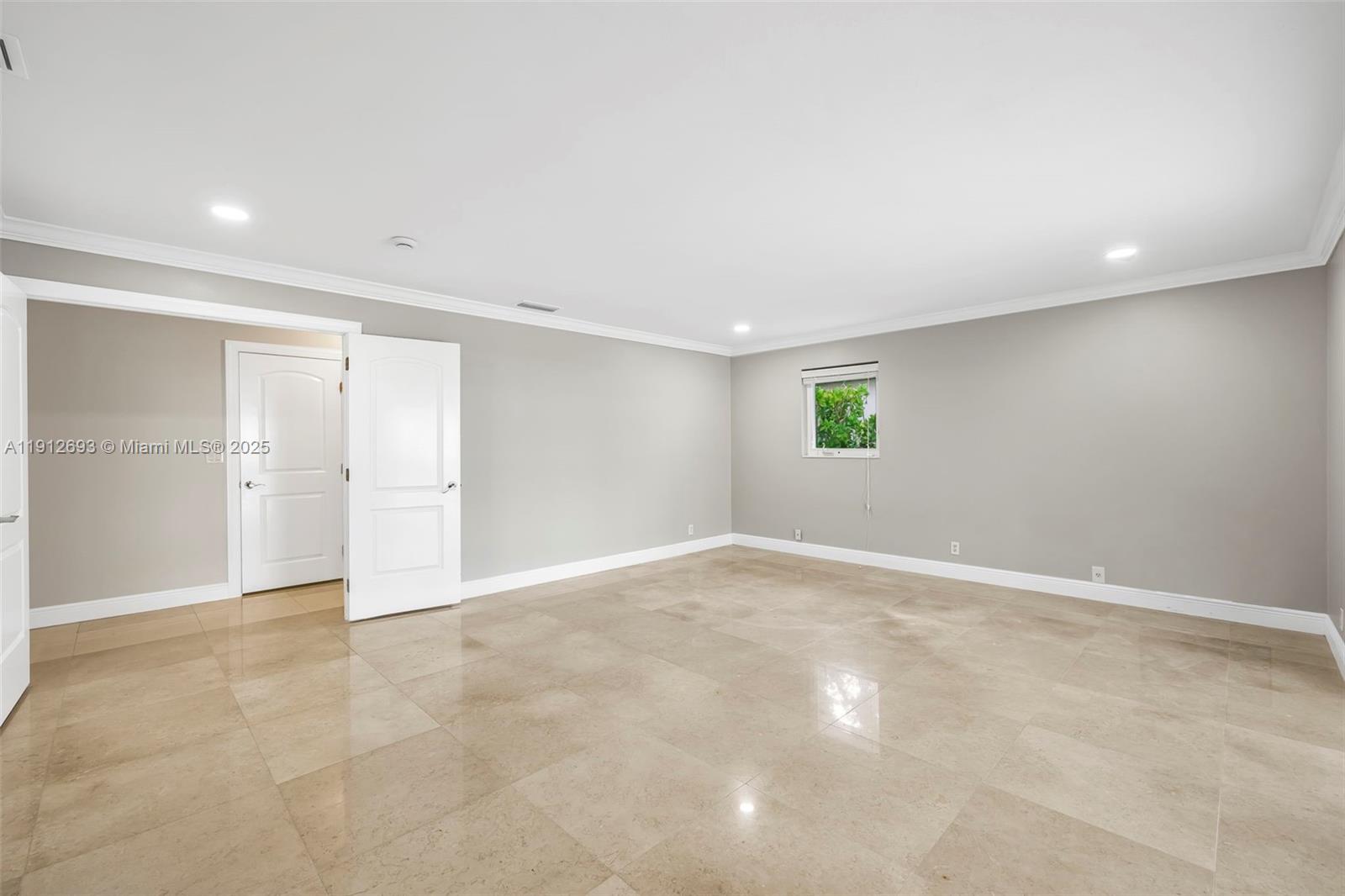 633 Solar Isle Drive Fort Lauderdale, FL 33301 - Photo 28 of 57 a view of an empty room with a window