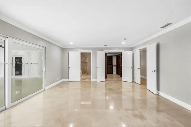 a view of swimming pool with palm trees
