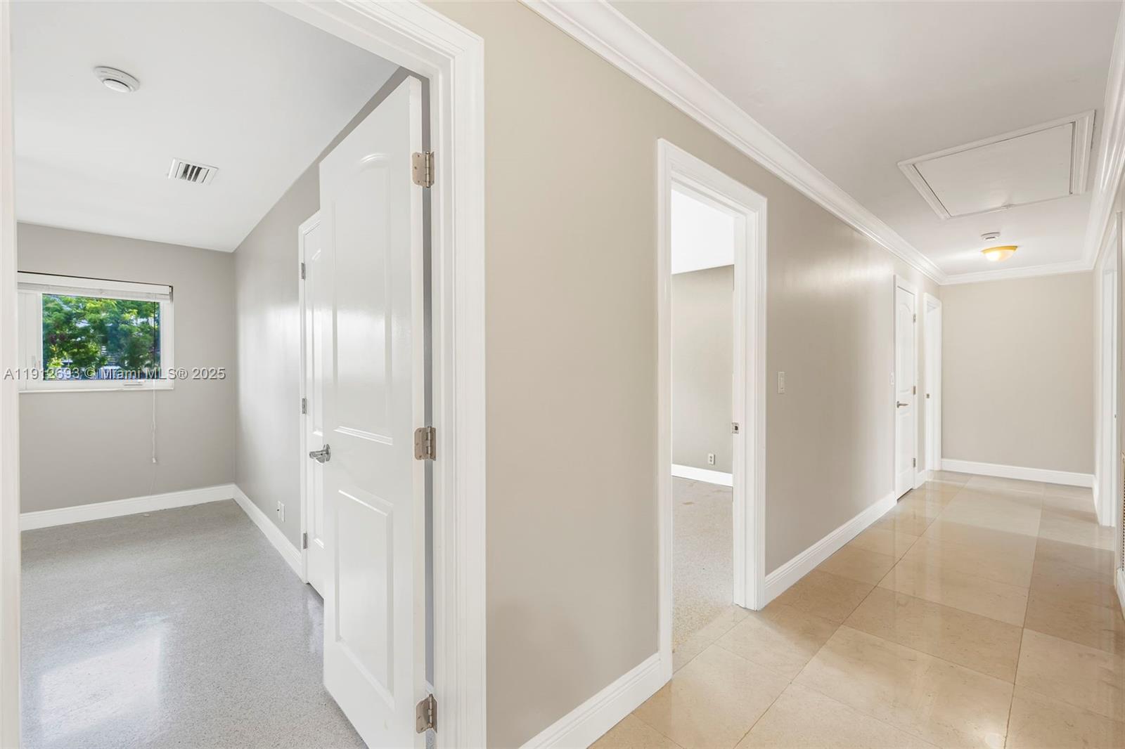 633 Solar Isle Drive Fort Lauderdale, FL 33301 - Photo 36 of 57 a view of hallway with bathroom and a glass door