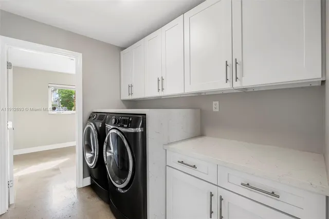 a kitchen with granite countertop stainless steel appliances window a sink and a counter