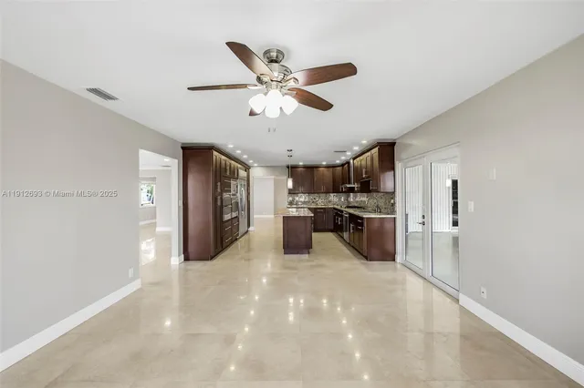 an aerial view of a house with a yard and lake view
