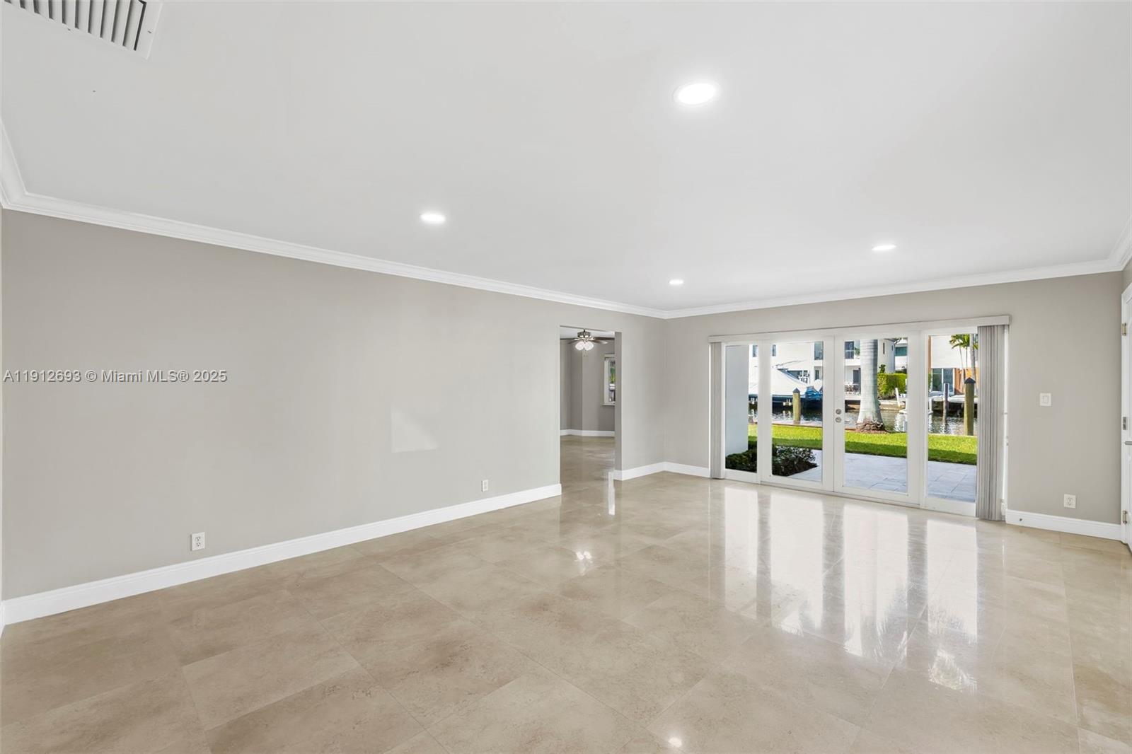 633 Solar Isle Drive Fort Lauderdale, FL 33301 - Photo 53 of 57 a view of an empty room with a window