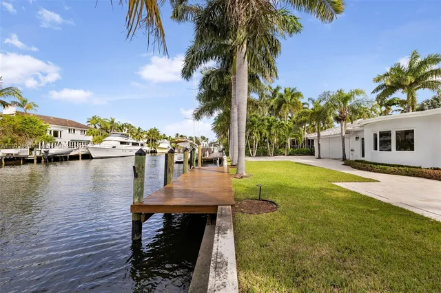 a swimming pool with outdoor seating and yard