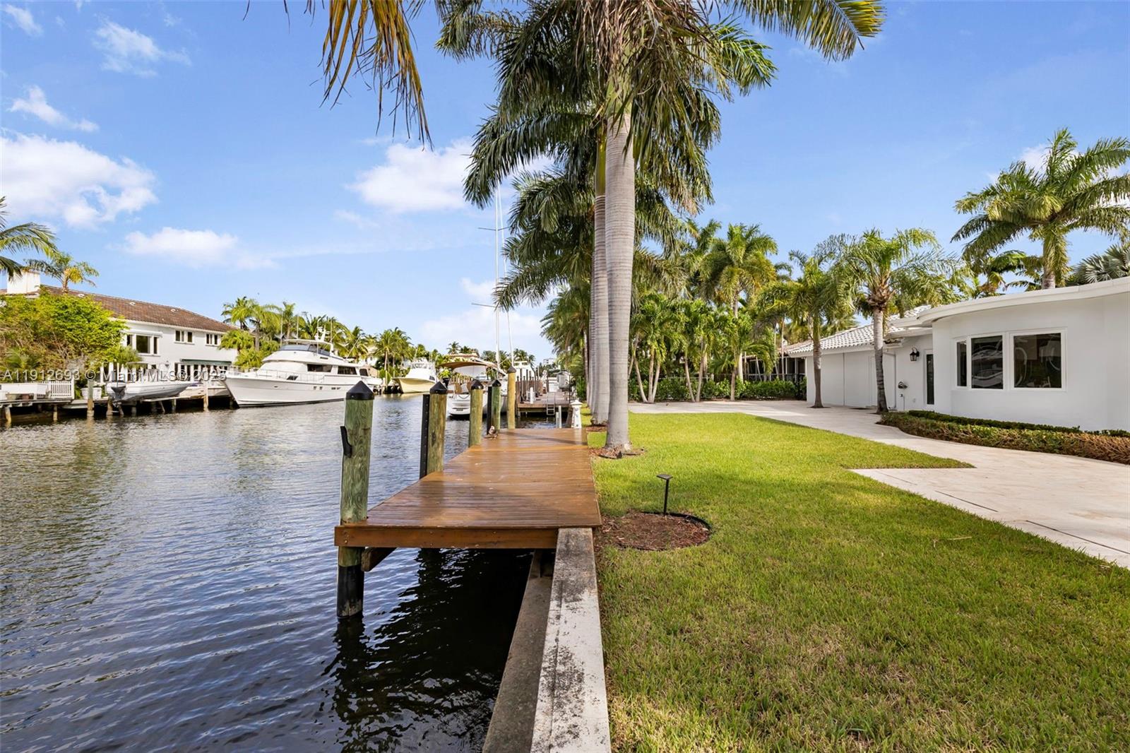633 Solar Isle Drive Fort Lauderdale, FL 33301 - Photo 10 of 57 a swimming pool with outdoor seating and yard