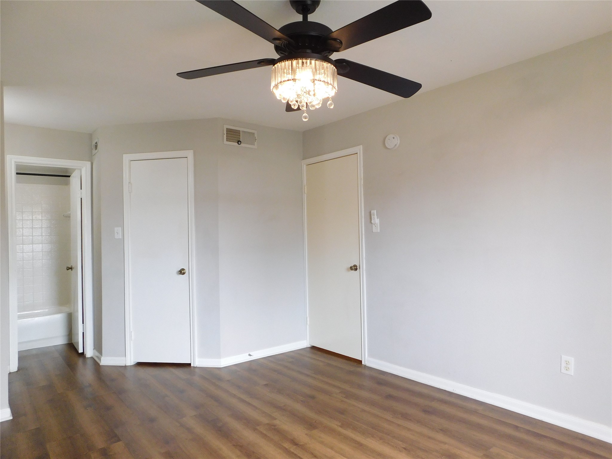 10101 South Gessner Road, Unit 912 Houston, TX 77071 - Photo 23 of 47 a view of an empty room with wooden floor