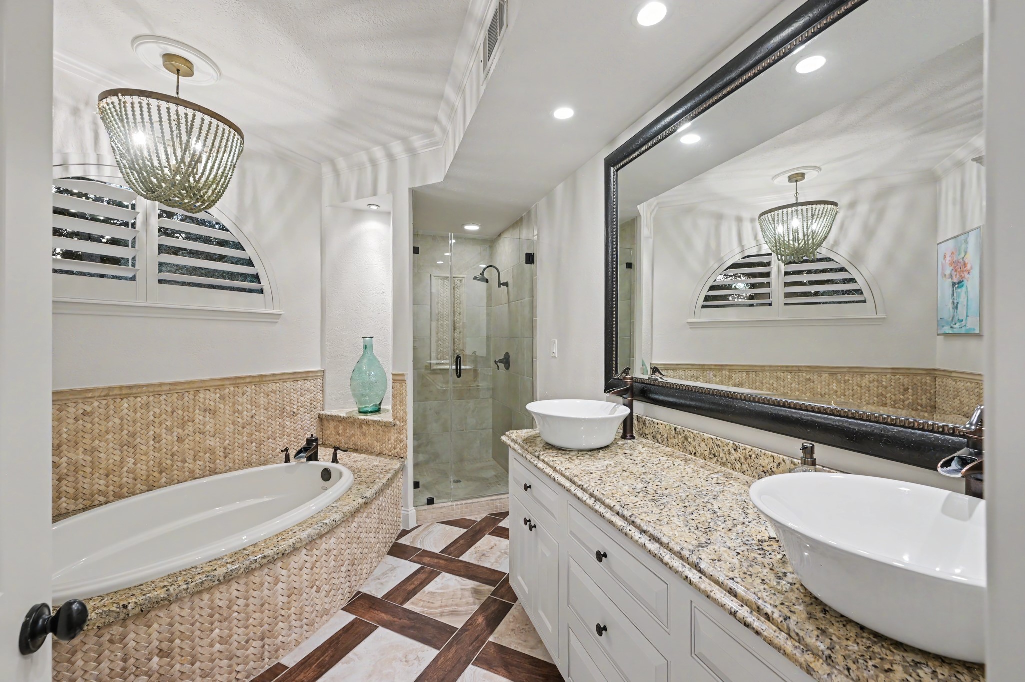 22 Watertree Court Spring, TX 77380 - Photo 40 of 45 Luxurious guest en suite featuring dual sinks, a well appointed tub and stand up shower