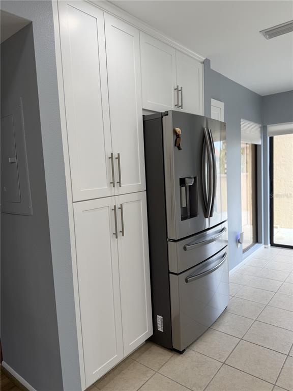 2004 Longpointe Circle Venice, FL 34293 - Photo 23 of 54 a kitchen with metallic refrigerator freezer and a dishwasher