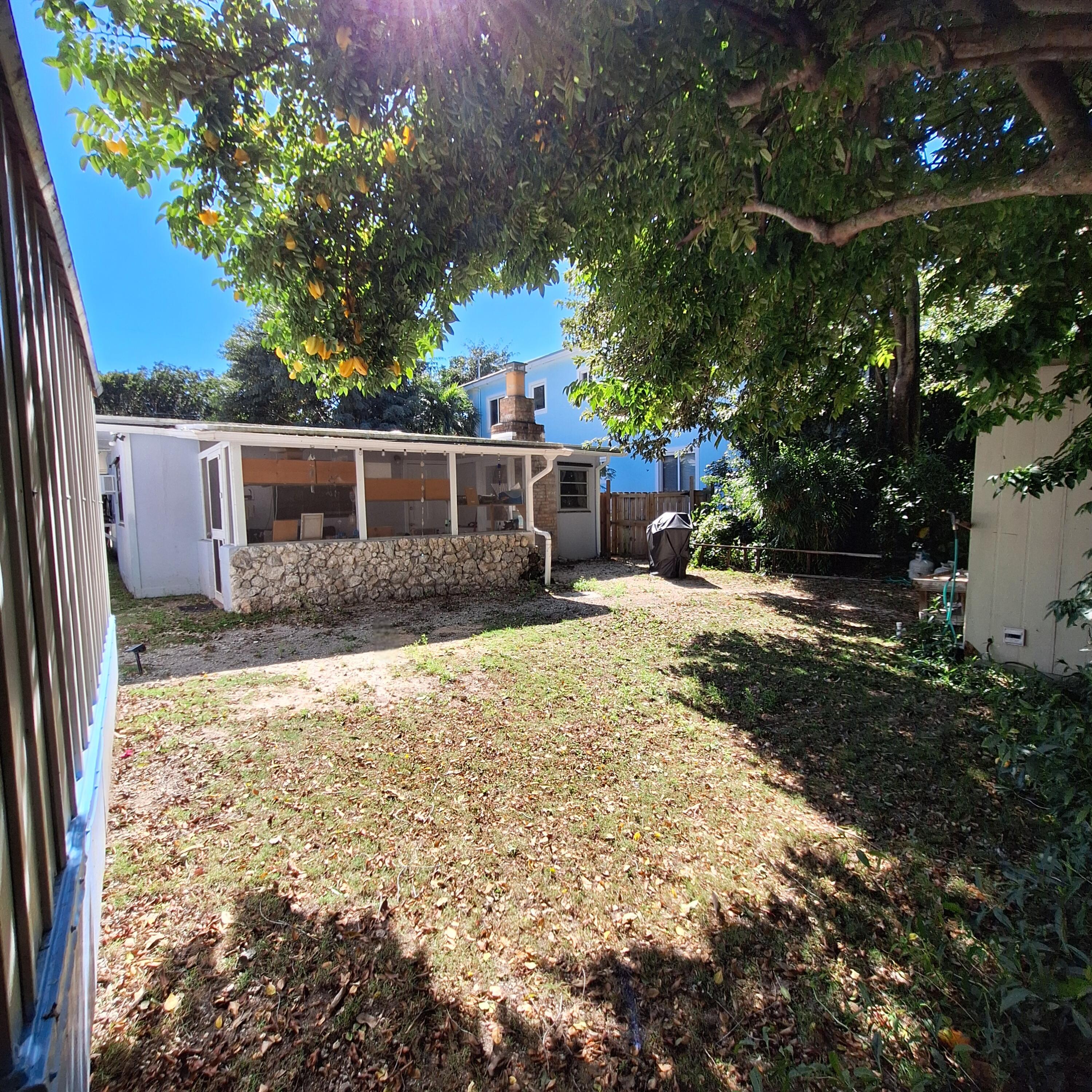 27 Pompano Avenue Key Largo, FL 33037 - Photo 17 of 25 a view of a house with backyard and sitting area