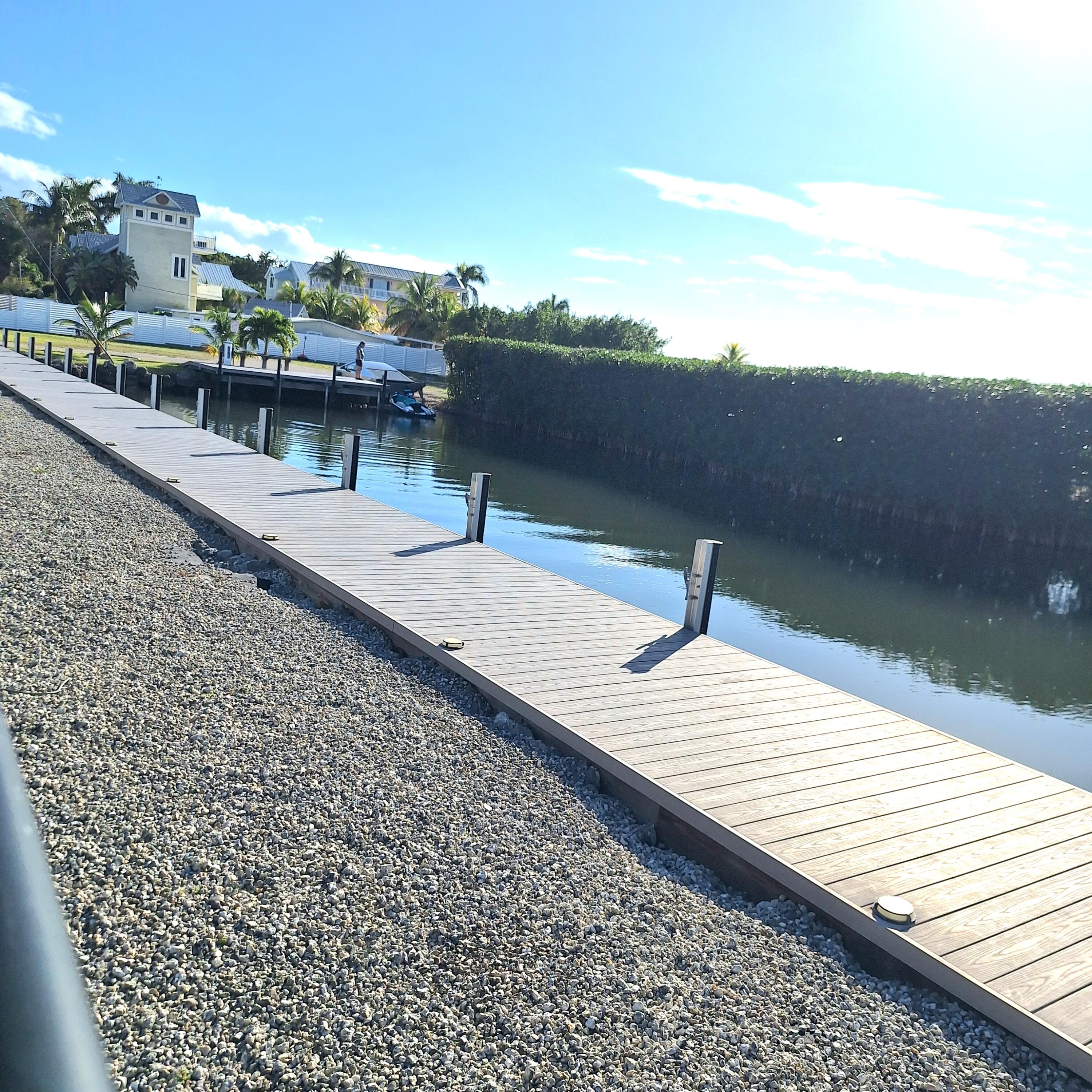 27 Pompano Avenue Key Largo, FL 33037 - Photo 22 of 25 a view of a terrace with outdoor seating