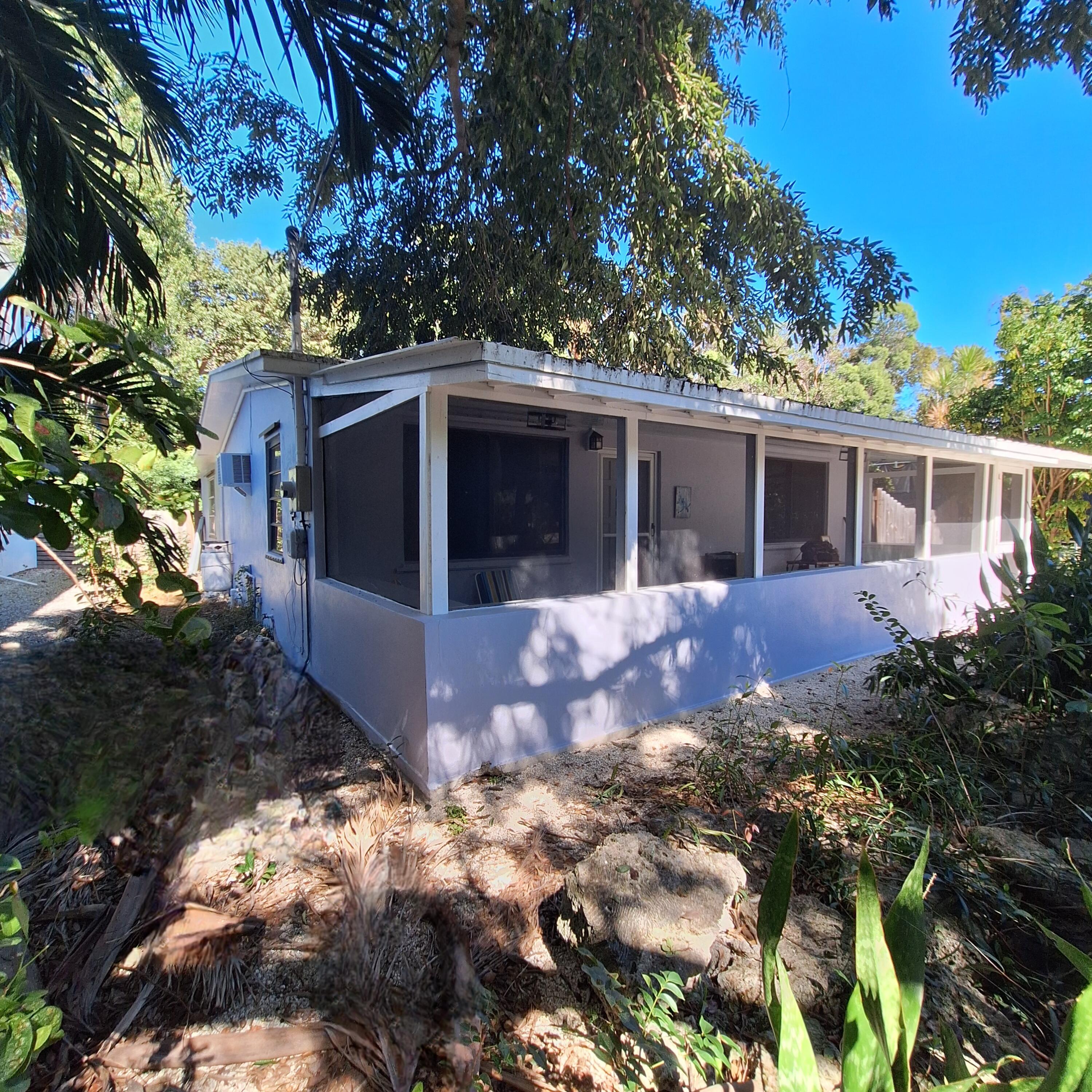 27 Pompano Avenue Key Largo, FL 33037 - Photo 3 of 25 a view of a house with a yard