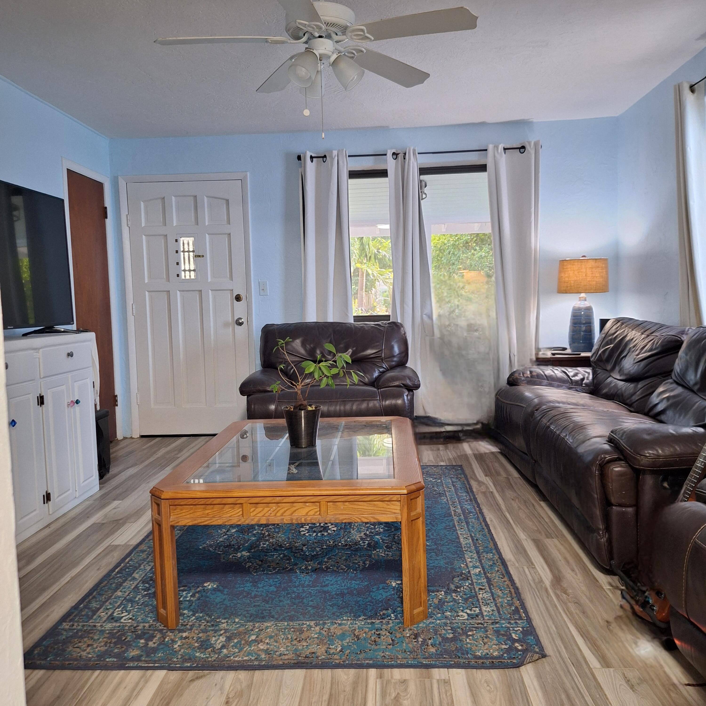 27 Pompano Avenue Key Largo, FL 33037 - Photo 9 of 25 a living room with furniture and a flat screen tv
