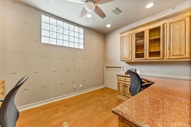 a bathroom with a sink a mirror and a window