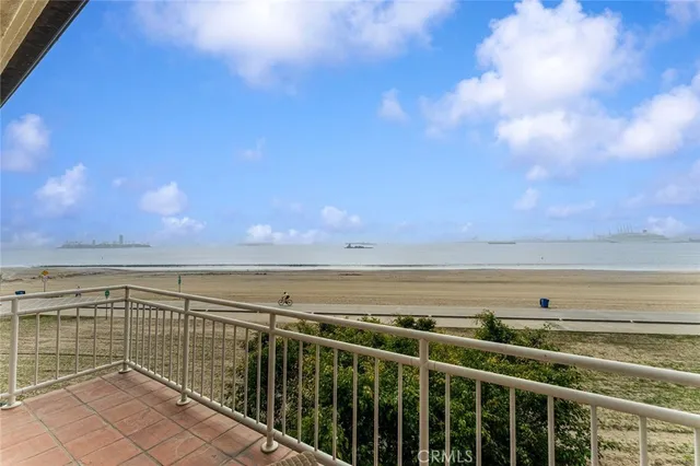 a roof deck with a table and chairs