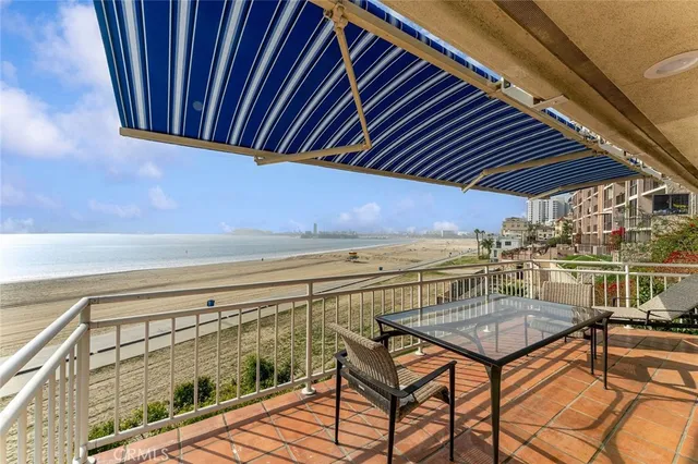 a view of a balcony with furniture