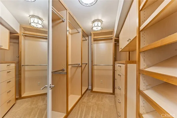 a spacious bathroom with a granite countertop sink and a mirror