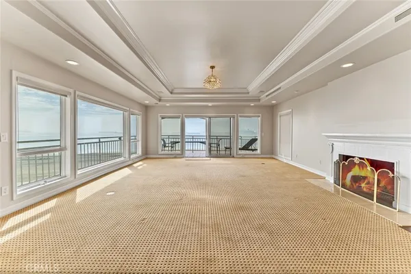 a view of an empty room with a fireplace