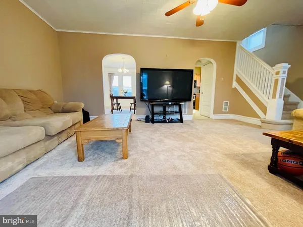 a view of a dining room with furniture and window