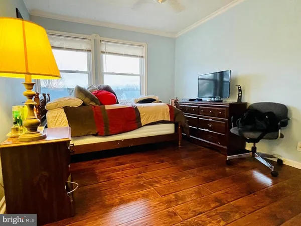 a view of an empty room and wooden floor