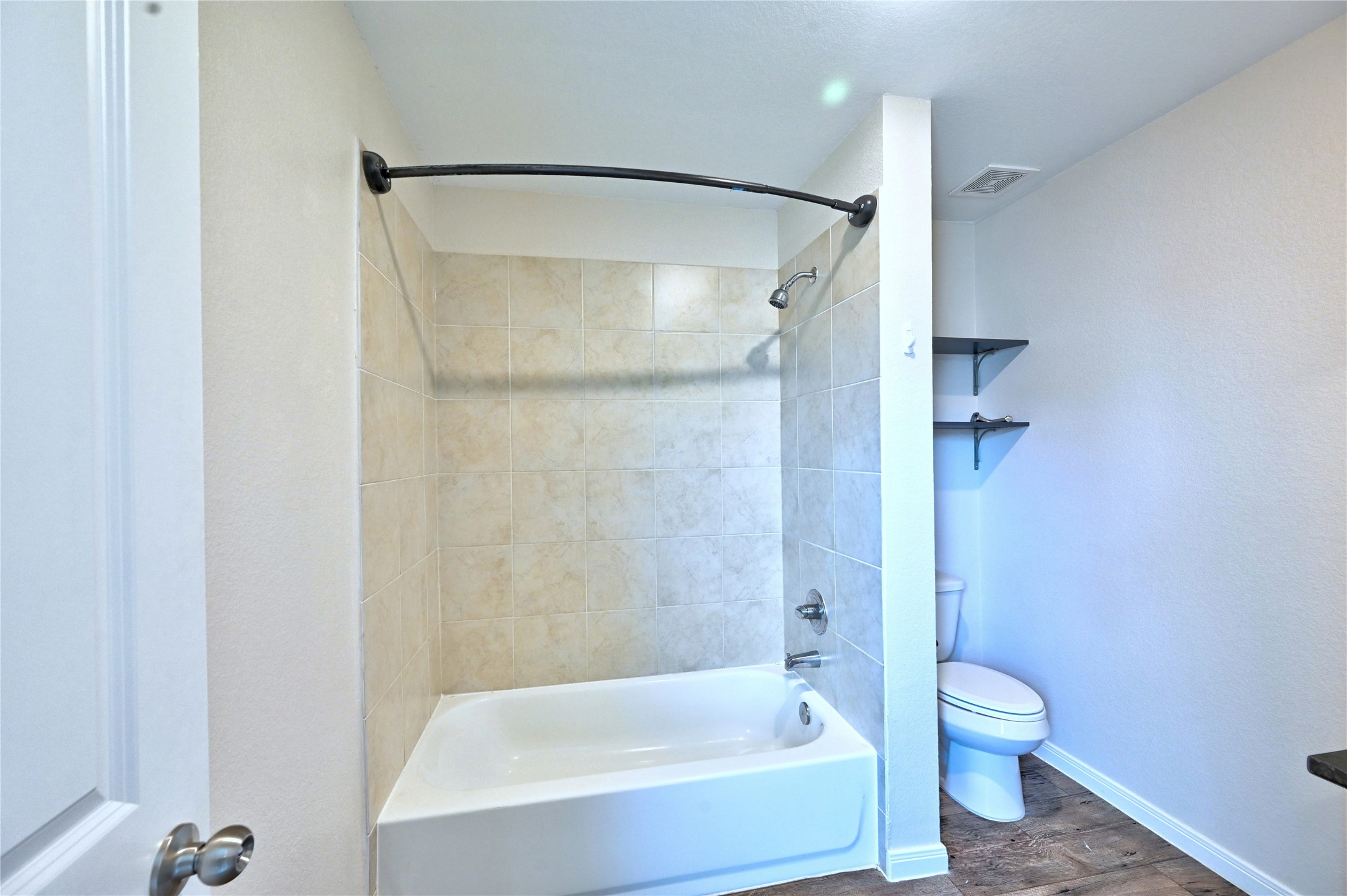 16623 Colleen Place Conroe, TX 77306 - Photo 17 of 44 a bathroom that has a glass shower door