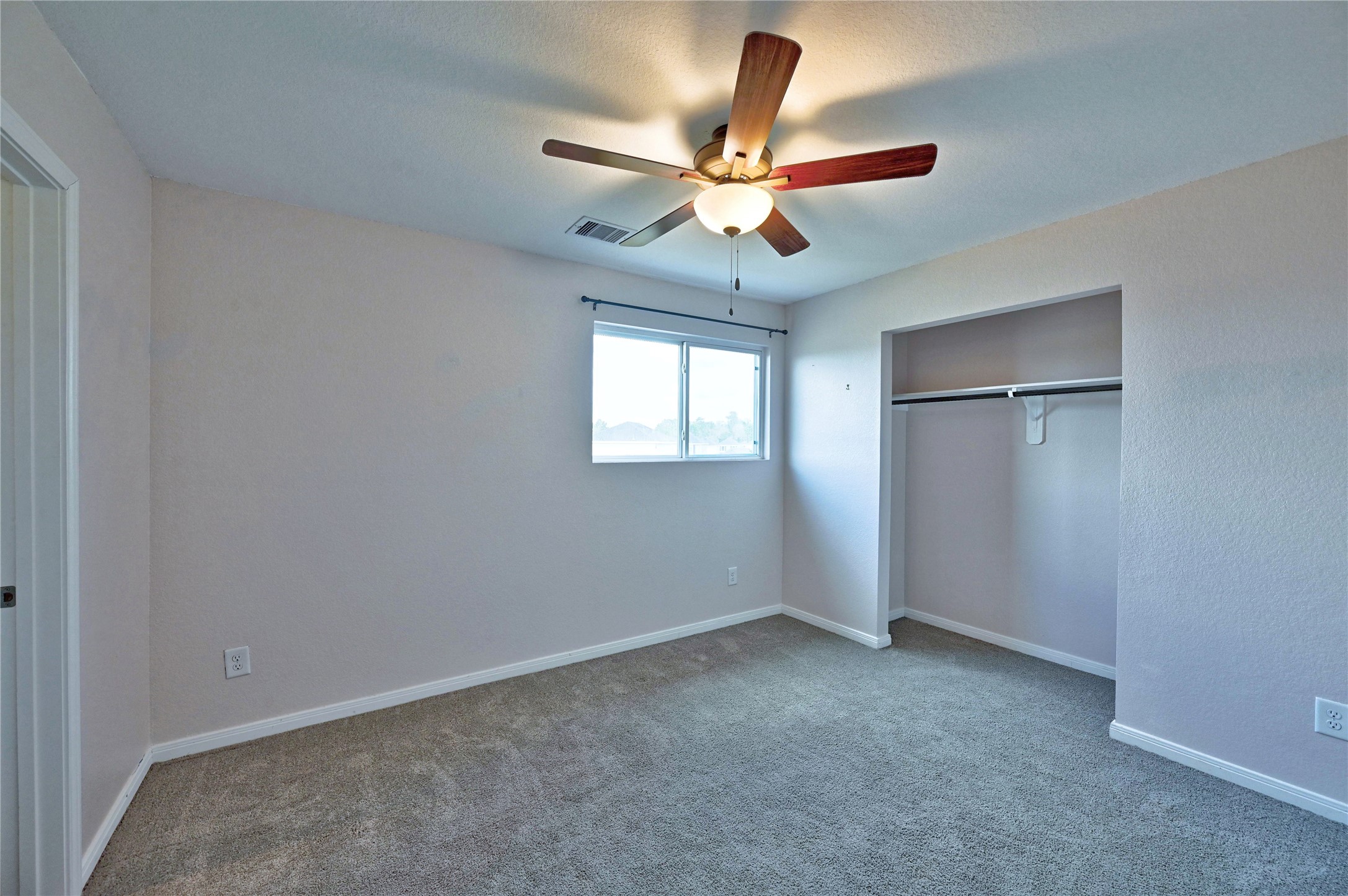 16623 Colleen Place Conroe, TX 77306 - Photo 25 of 44 wooden floor in an empty room with a window