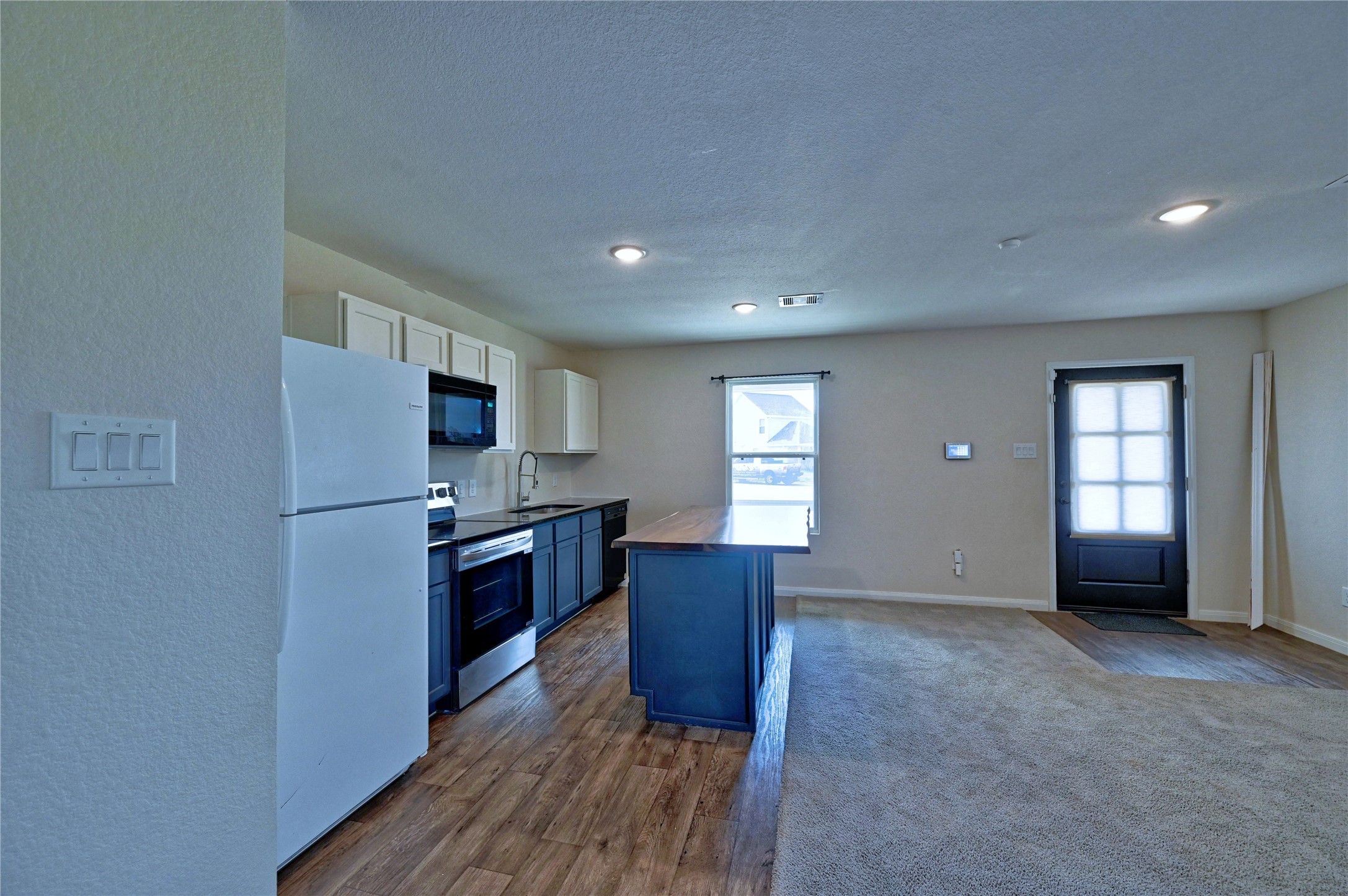 16623 Colleen Place Conroe, TX 77306 - Photo 44 of 44 a kitchen with stainless steel appliances granite countertop a refrigerator and a stove top oven