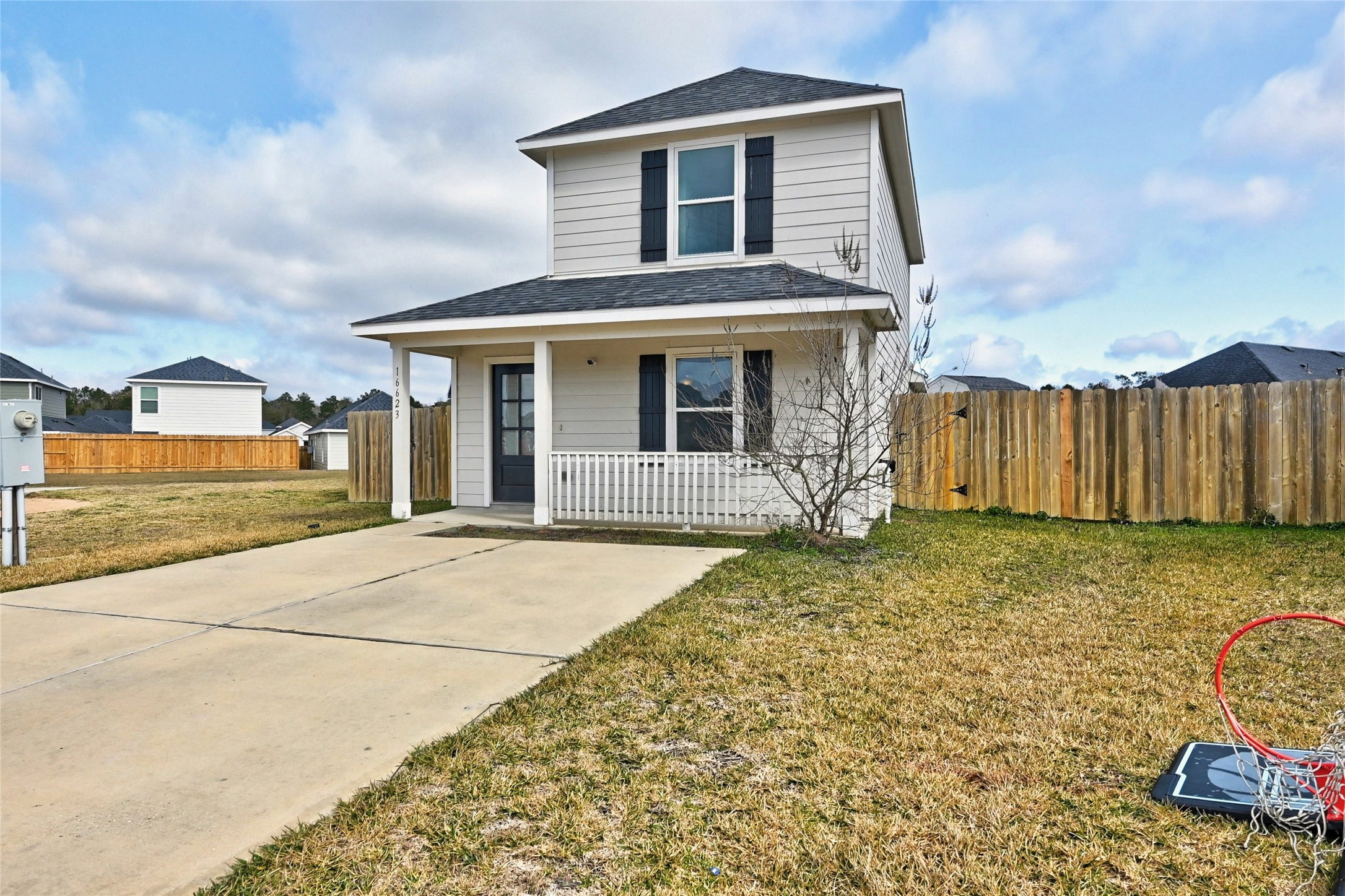16623 Colleen Place Conroe, TX 77306 - Photo 6 of 44 a front view of a house with a yard