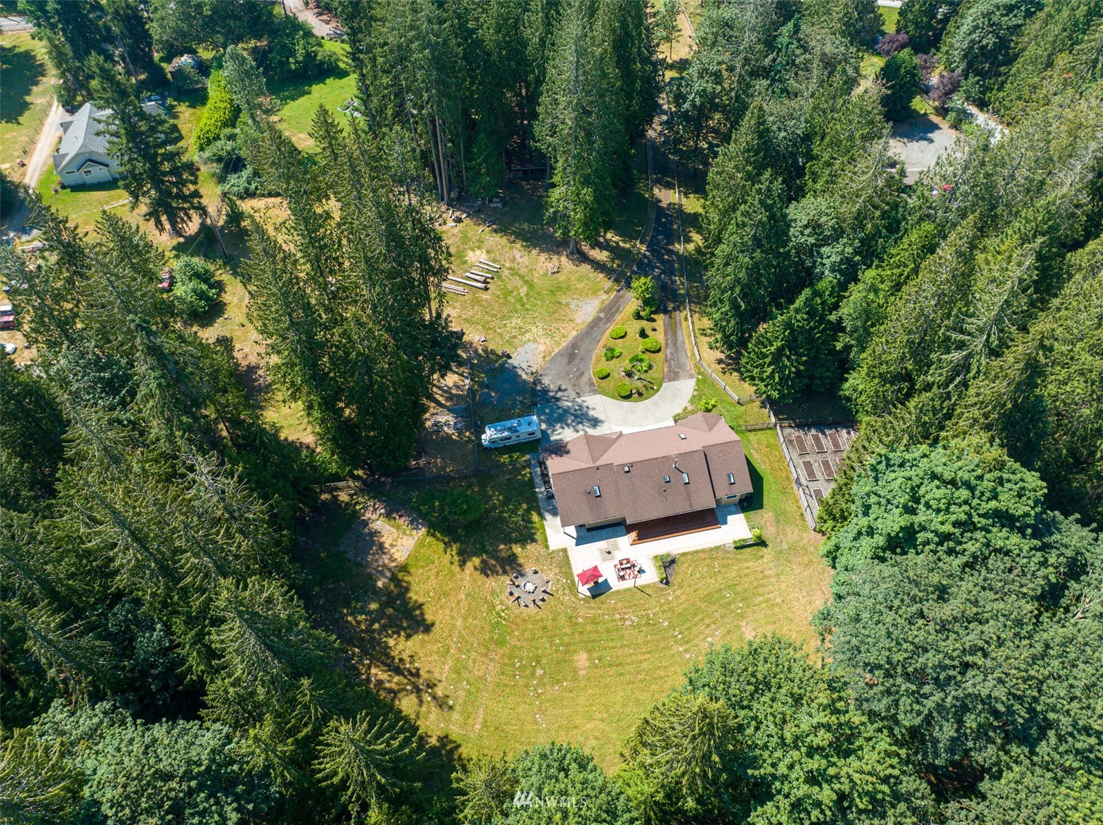 12115 Gould Road Graham, WA 98338 - Photo 27 of 37 an aerial view of a house with a yard lake house and outdoor seating