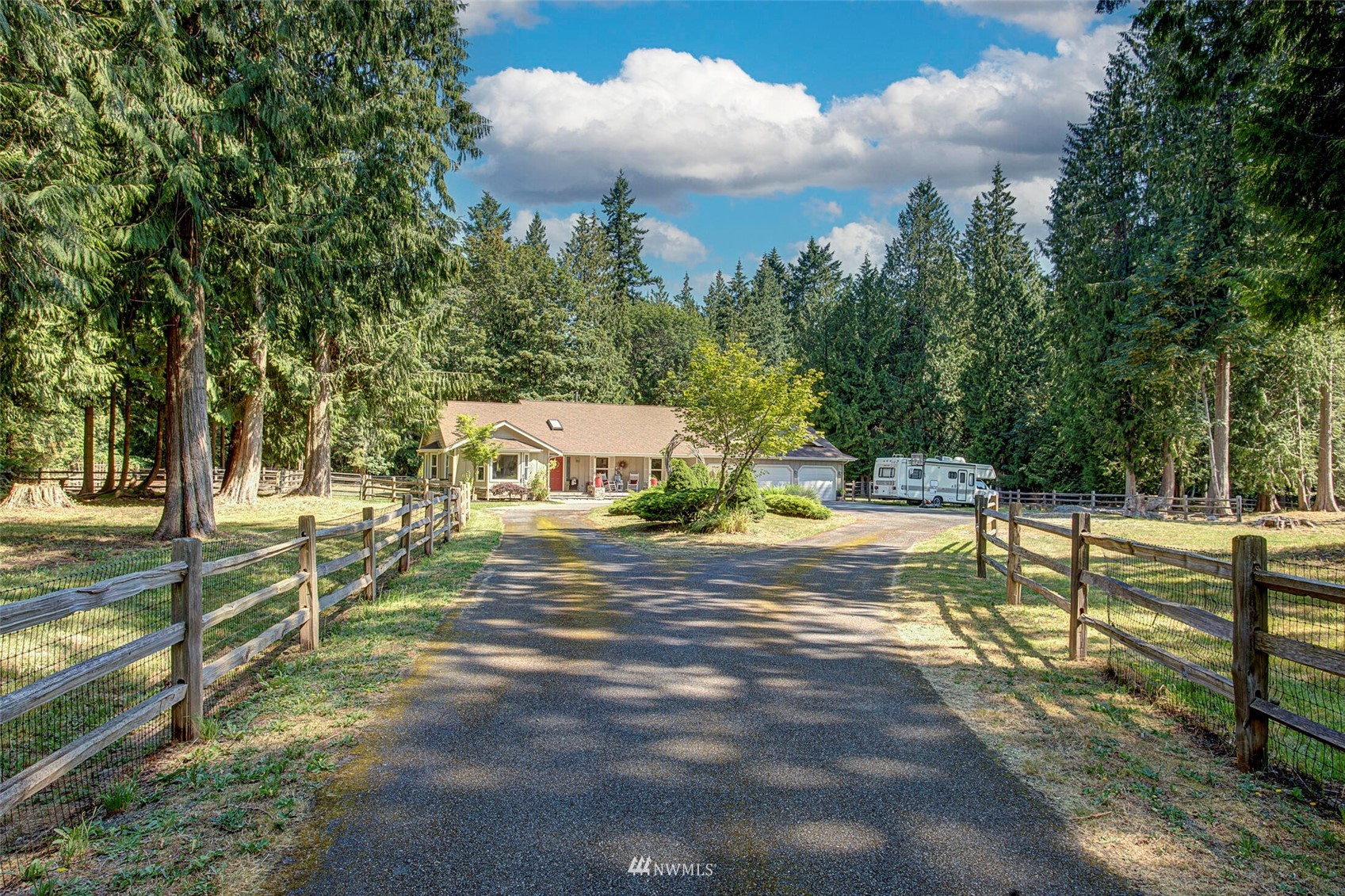 12115 Gould Road Graham, WA 98338 - Photo 5 of 37 a view of a town with large trees