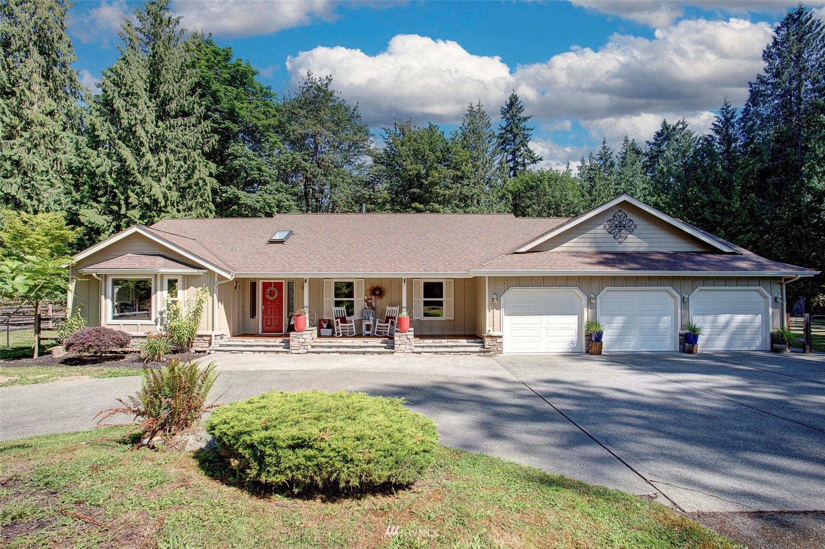 12115 Gould Road Graham, WA 98338 - Photo 7 of 37 a view of a house with yard and trees in the background