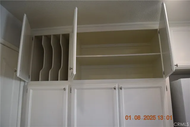 a stove top oven sitting inside of a kitchen