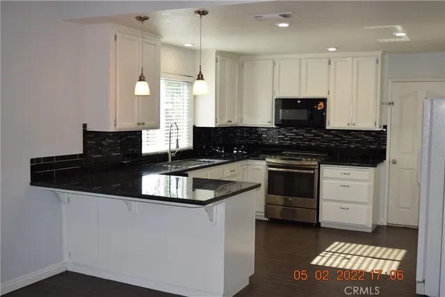 a view of a livingroom with wooden floor