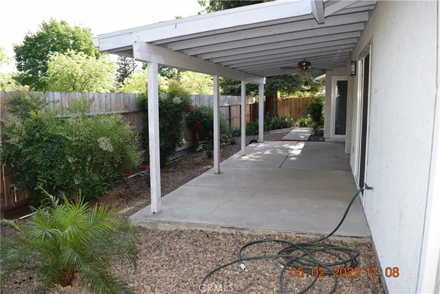 a view of a pathway of house with yard