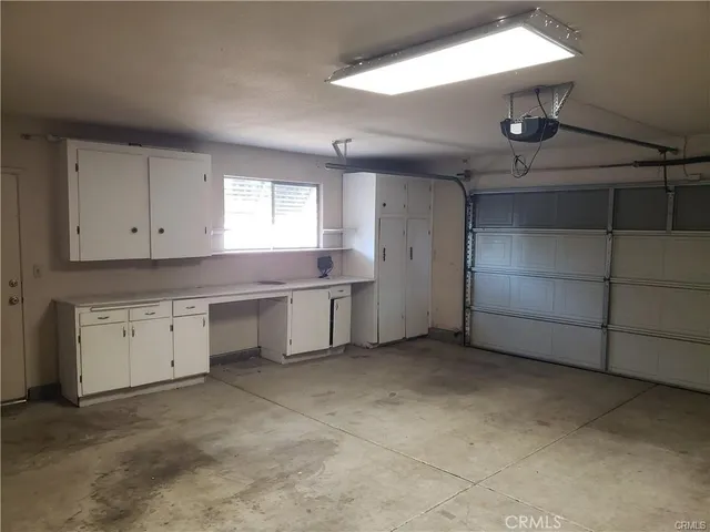 a kitchen with a refrigerator and window