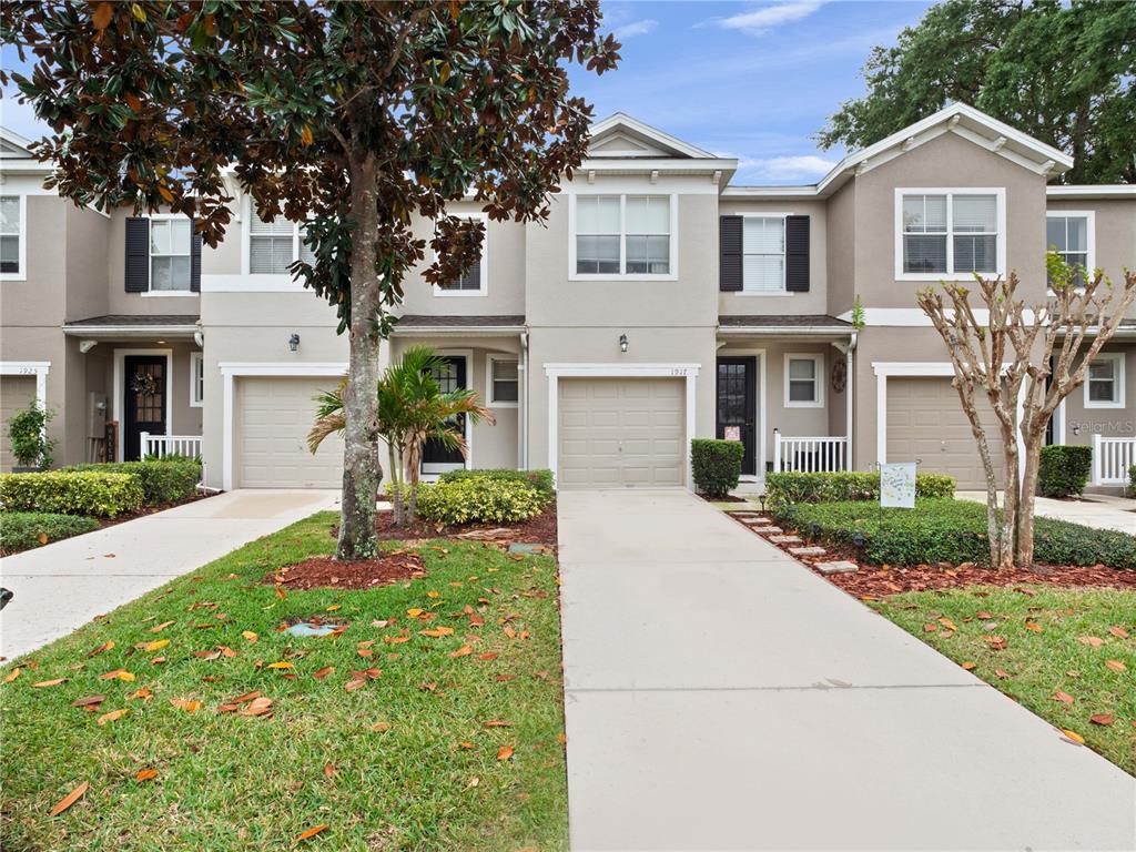 1917 Compass Flower Way Ocoee, FL 34761 - Photo 1 of 1 a front view of a house with garden