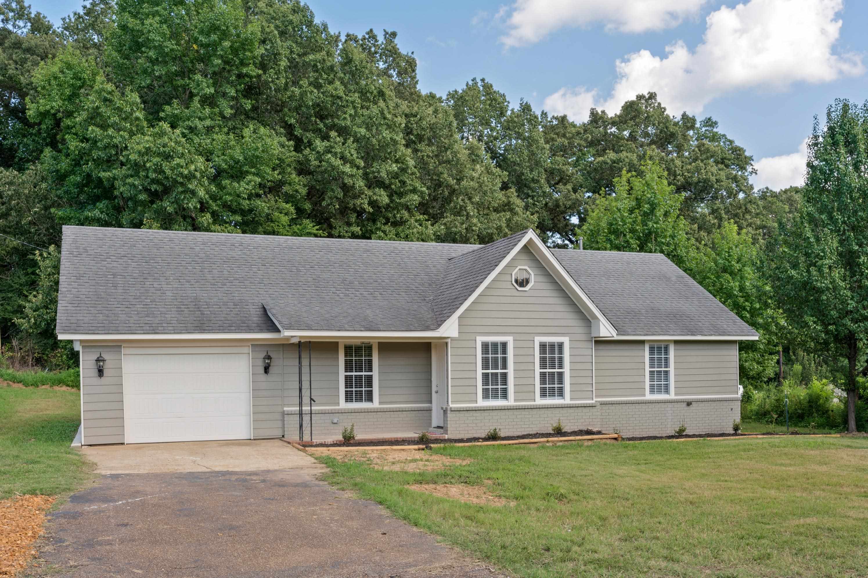 3282 Sunnyside Road Brighton, TN 38011 - Photo 1 of 24 Single story home with a garage and a front lawn