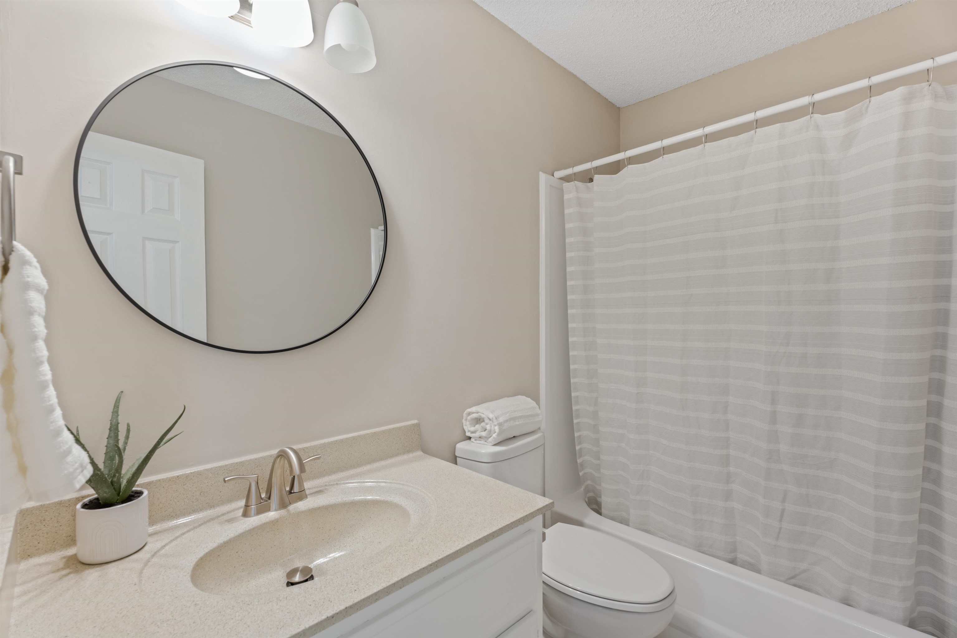 3282 Sunnyside Road Brighton, TN 38011 - Photo 21 of 24 Full bathroom with vanity, toilet, a textured ceiling, and shower / bath combination with curtain